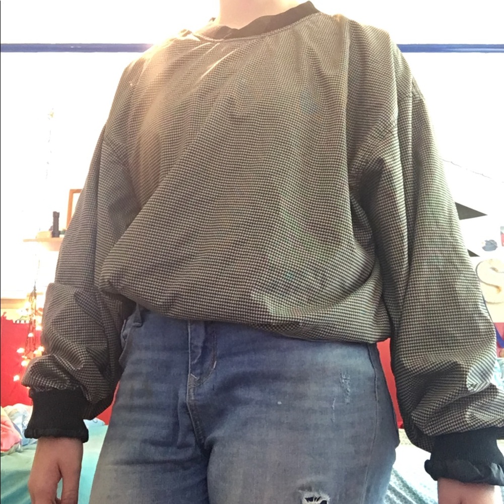 black and tan patterned windbreaker